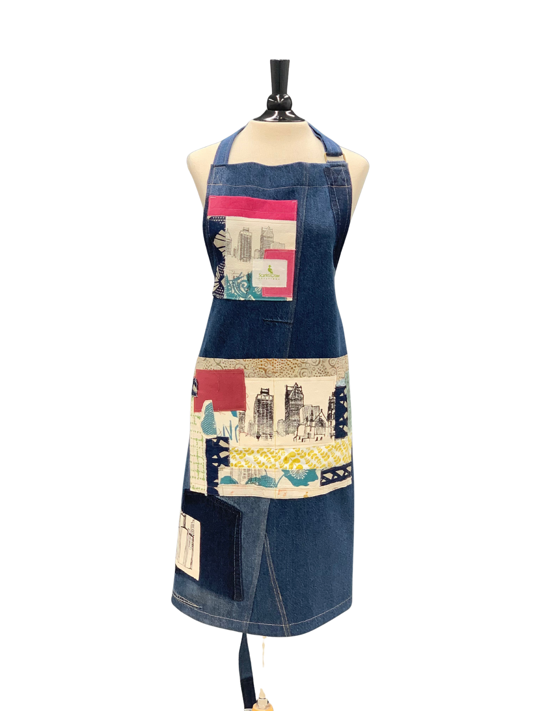 Denim apron with patchwork Detroit skyline panel